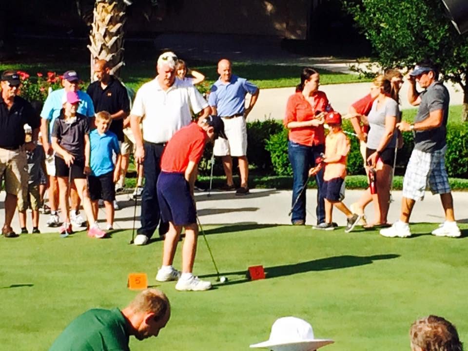 Dimitri putting at the father-son putting tournament, 2015